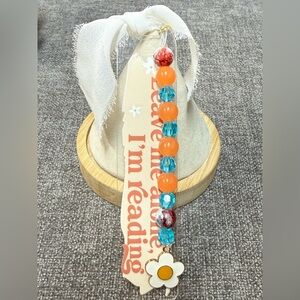 Acrylic bookmark with “Leave me alone, I’m reading” design, and beads. NWOT